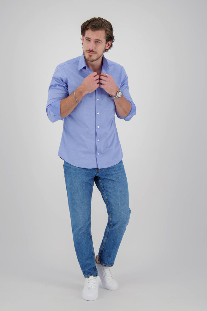 Model wearing Montebello Celeste Dress shirt